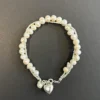 Pulseras cruzada con perlas
